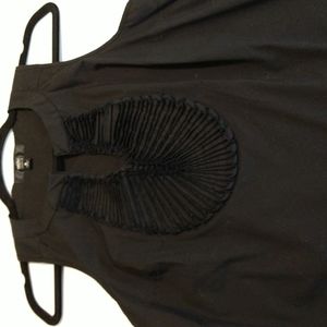 Black razorback sleeveless round neck top with v tufted front stretch  …